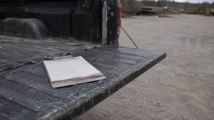 Quote pad on a pickup tailgate waiting on estimate follow-up